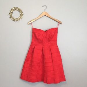 Anthropologie • Sans Souci red strapless cocktail